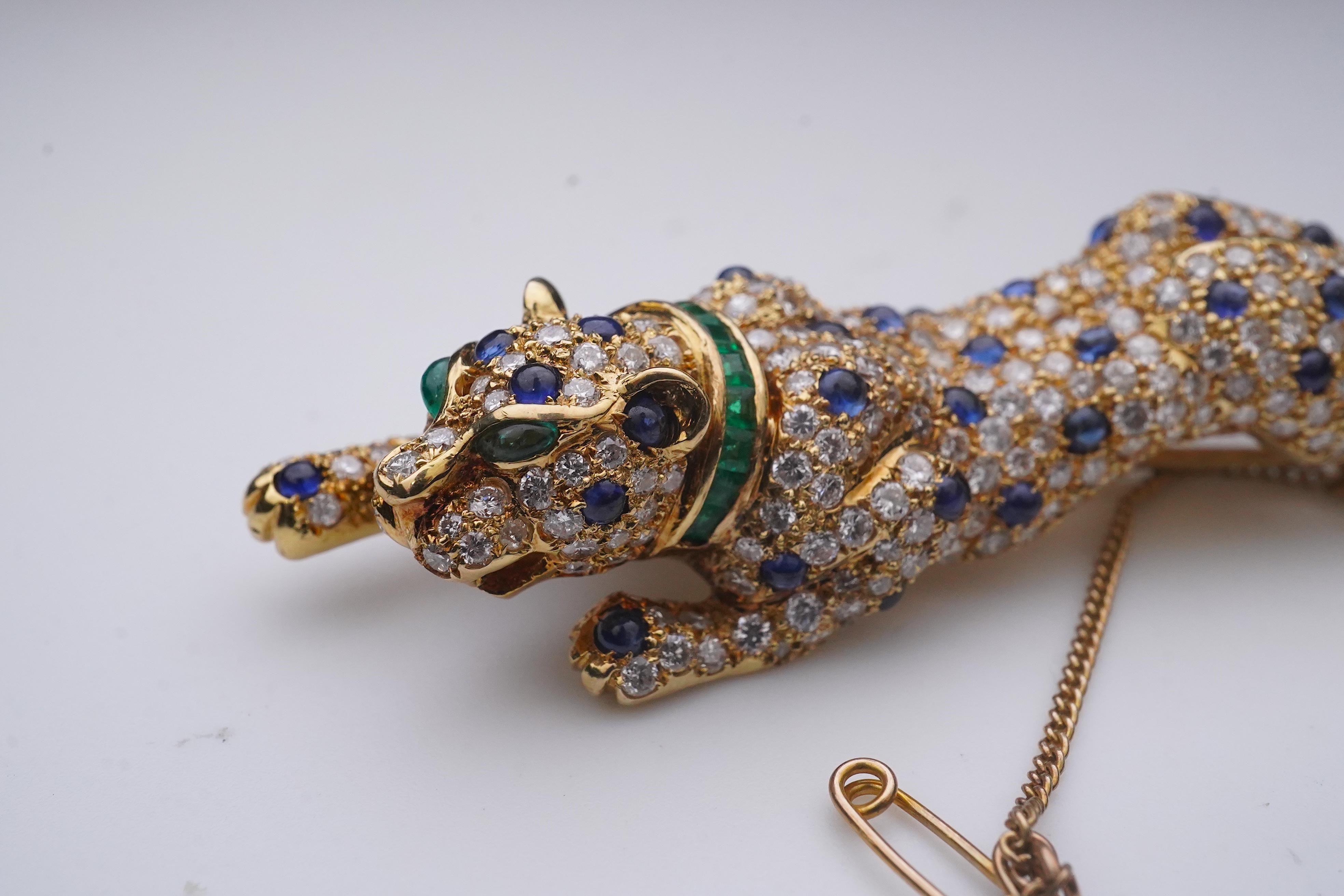 A sapphire, emerald and diamond brooch